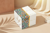 Decorative box with colorful pattern on a beige background Decorative box with colorful pattern on a beige background