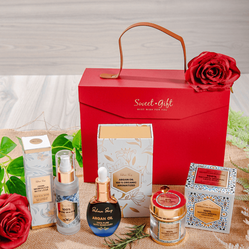 Essence of Marrakech home spa kit: rhassoul clay, rose water and rosemary argan oil in a red gift bag