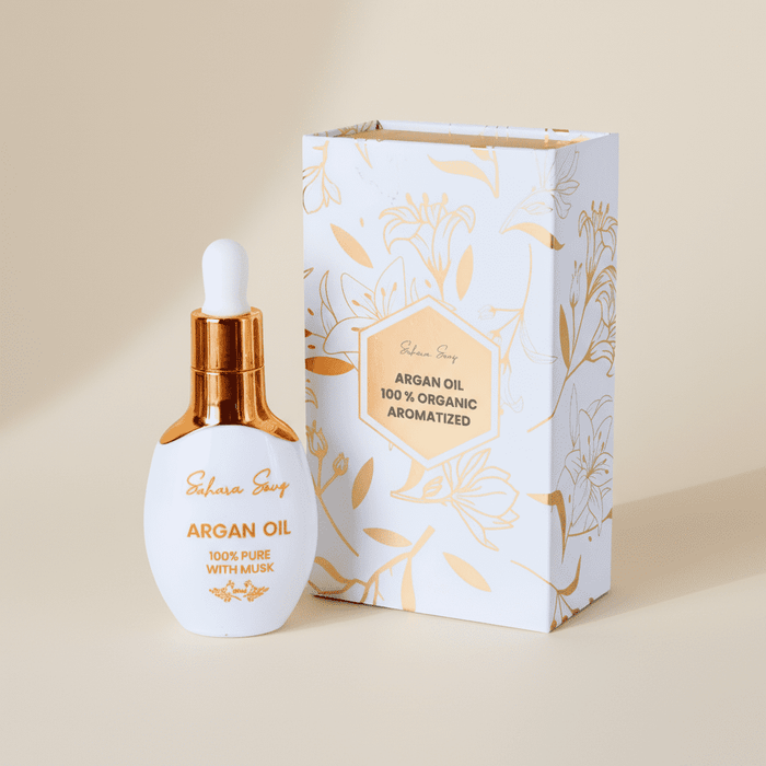 Musk body oil with argan, white dropper bottle beside its gift box