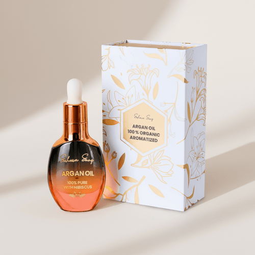 Hibiscus anti-aging face oil, amber dropper bottle beside its gift box