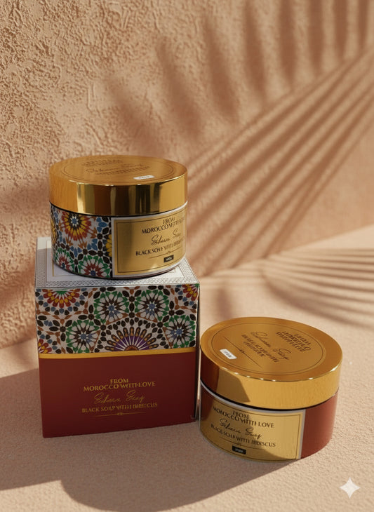 Two jars of moroccan beldi soap on a sandy background