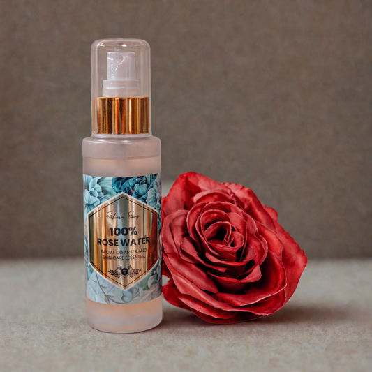 rose water bottle shot with red roses