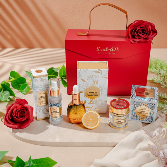 Argan oil Gift set with skincare products and a red box labeled 'Sweet Gift' on a decorative surface.